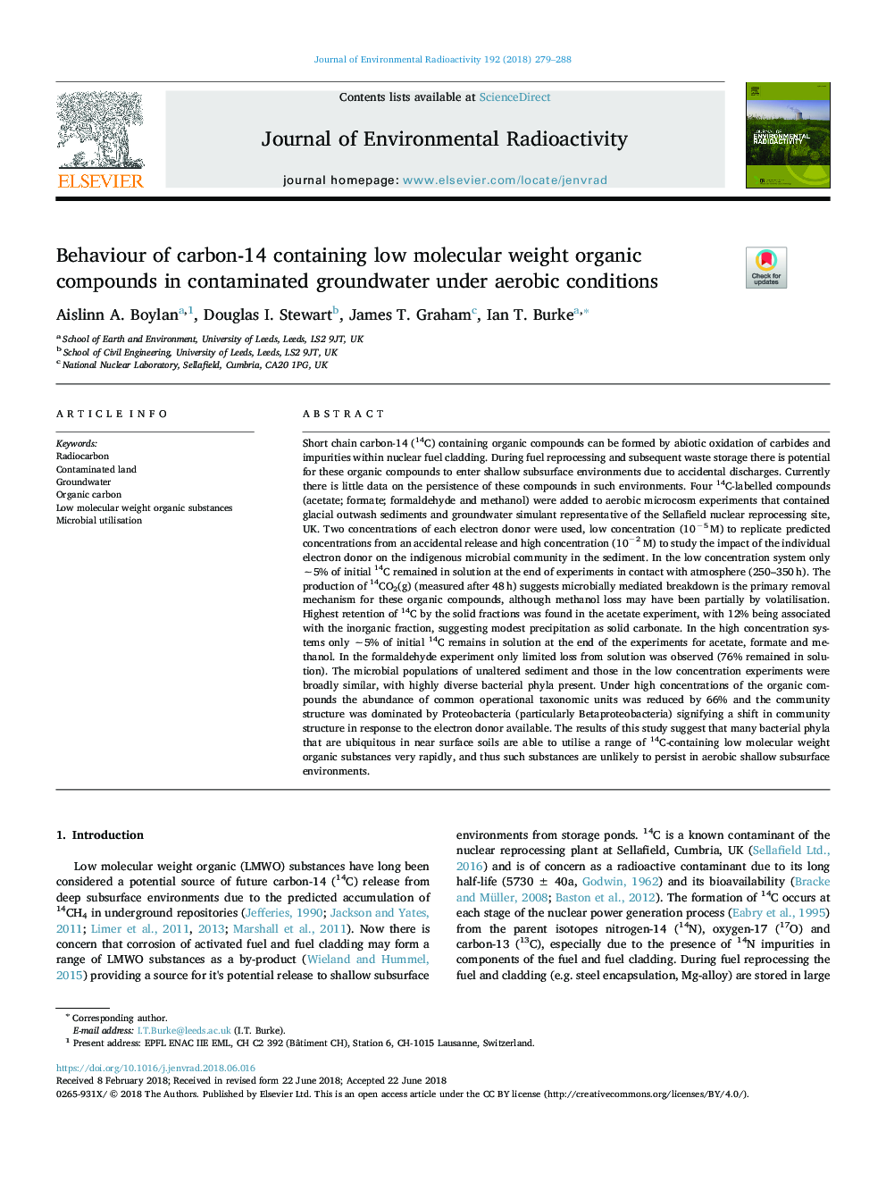 Behaviour of carbon-14 containing low molecular weight organic compounds in contaminated groundwater under aerobic conditions