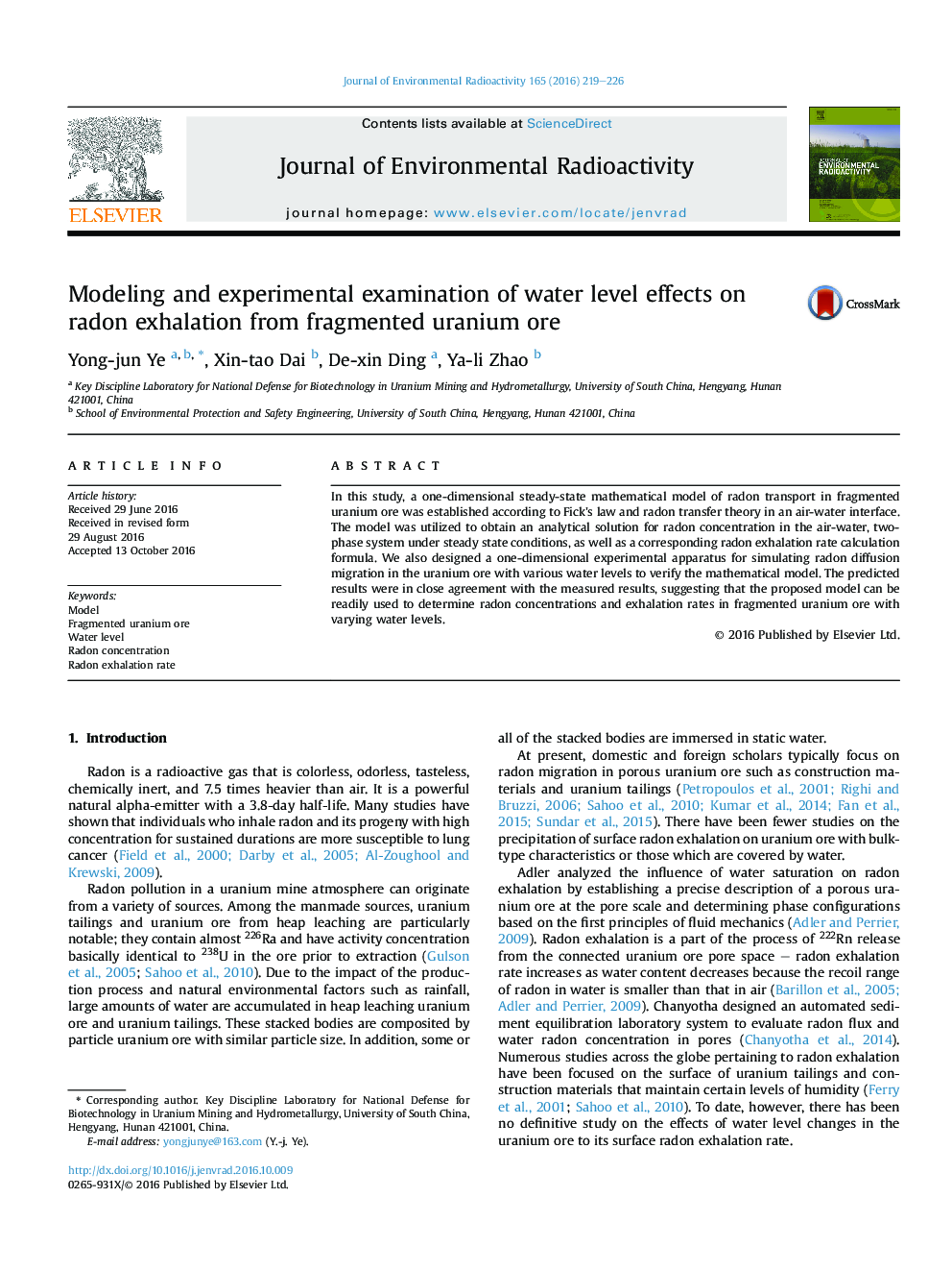 Modeling and experimental examination of water level effects on radon exhalation from fragmented uranium ore