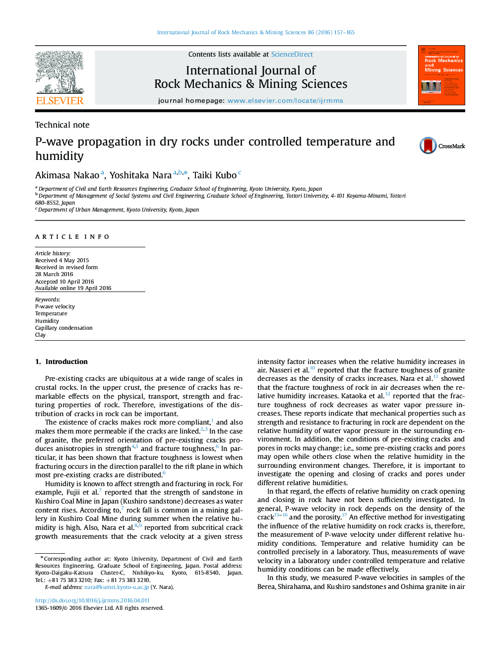 P-wave propagation in dry rocks under controlled temperature and humidity