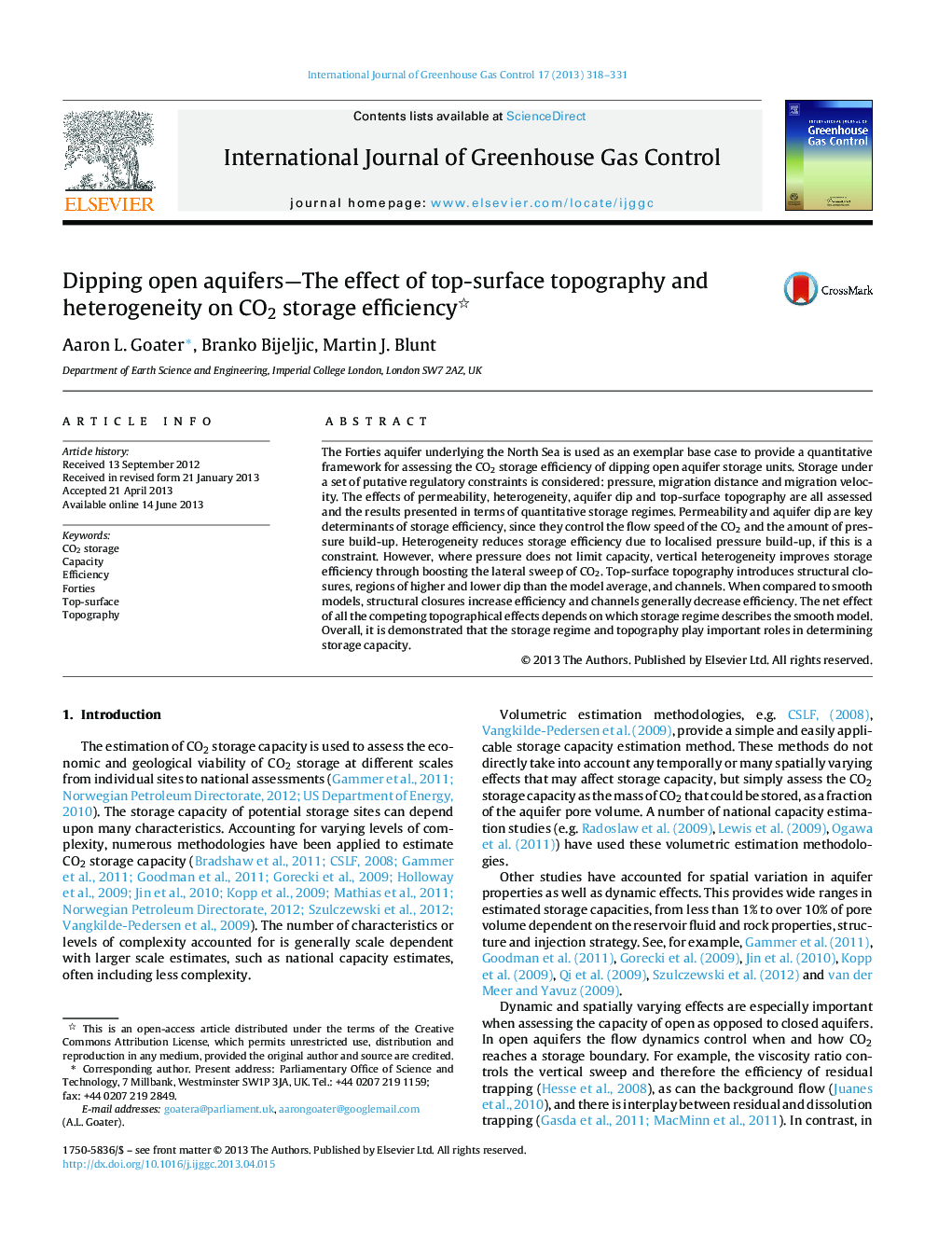 Dipping open aquifers-The effect of top-surface topography and heterogeneity on CO2 storage efficiency