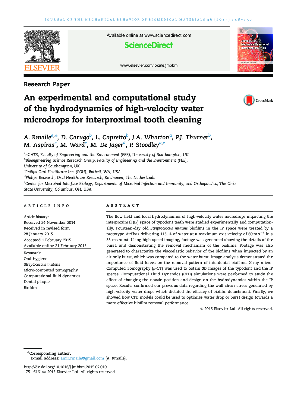 An experimental and computational study of the hydrodynamics of high-velocity water microdrops for interproximal tooth cleaning