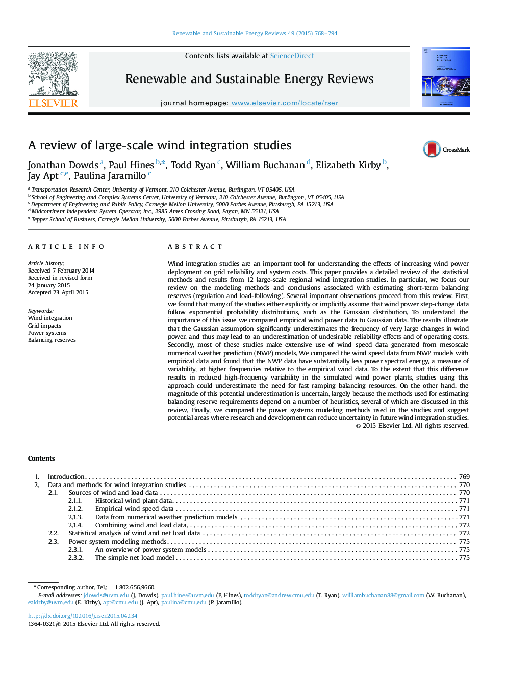 A review of large-scale wind integration studies