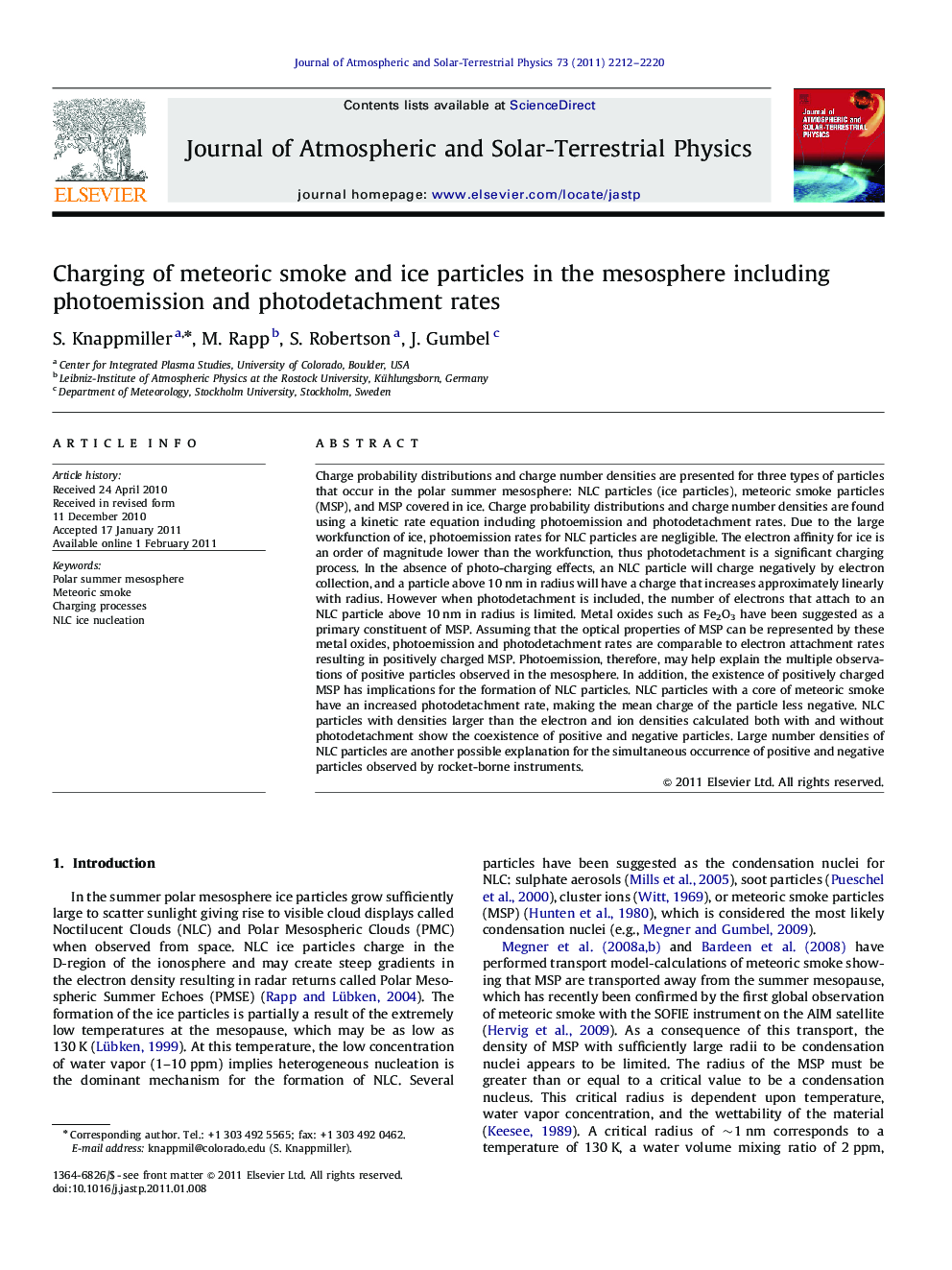 Charging of meteoric smoke and ice particles in the mesosphere including photoemission and photodetachment rates