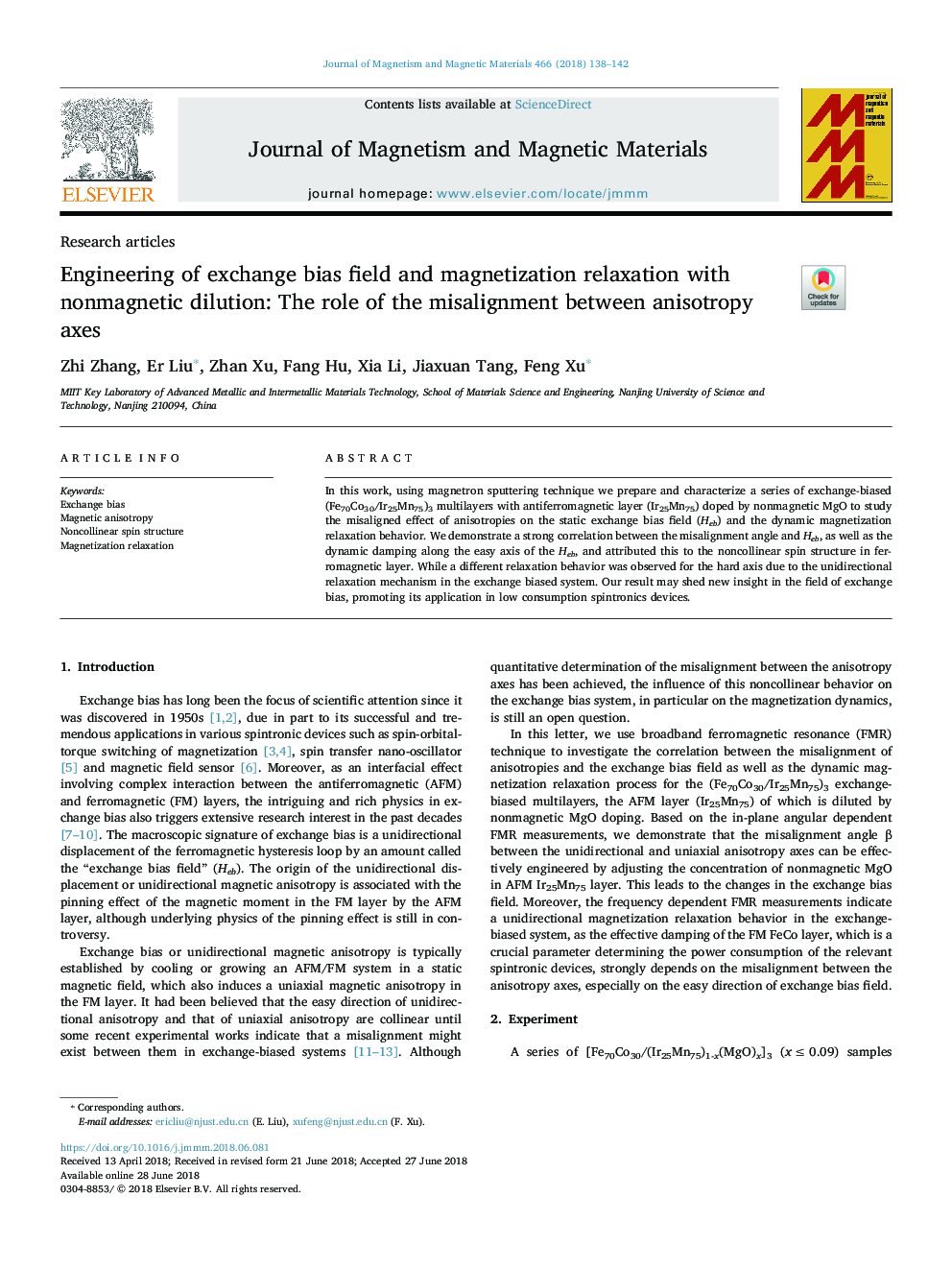 Engineering of exchange bias field and magnetization relaxation with nonmagnetic dilution: The role of the misalignment between anisotropy axes