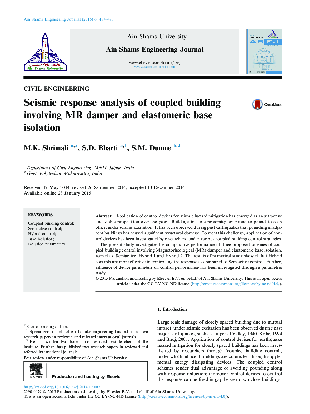 Seismic response analysis of coupled building involving MR damper and elastomeric base isolation 