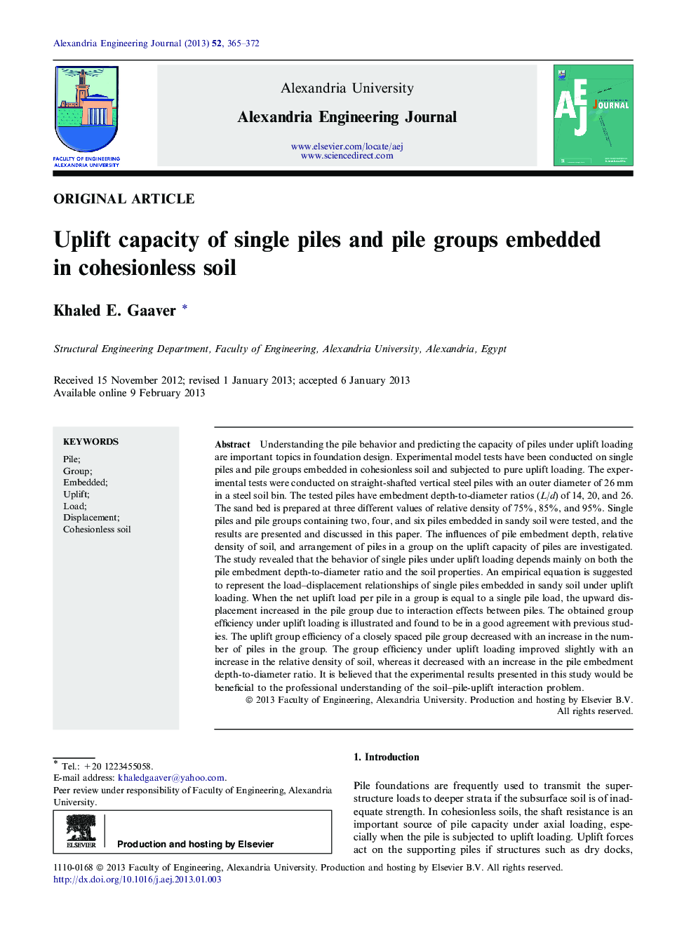 Uplift capacity of single piles and pile groups embedded in cohesionless soil 