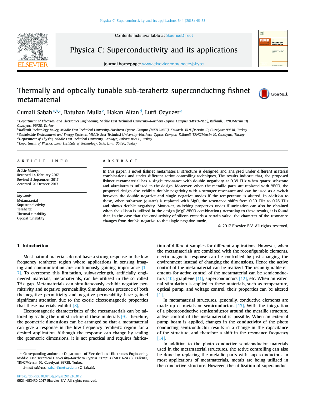 Thermally and optically tunable sub-terahertz superconducting fishnet metamaterial