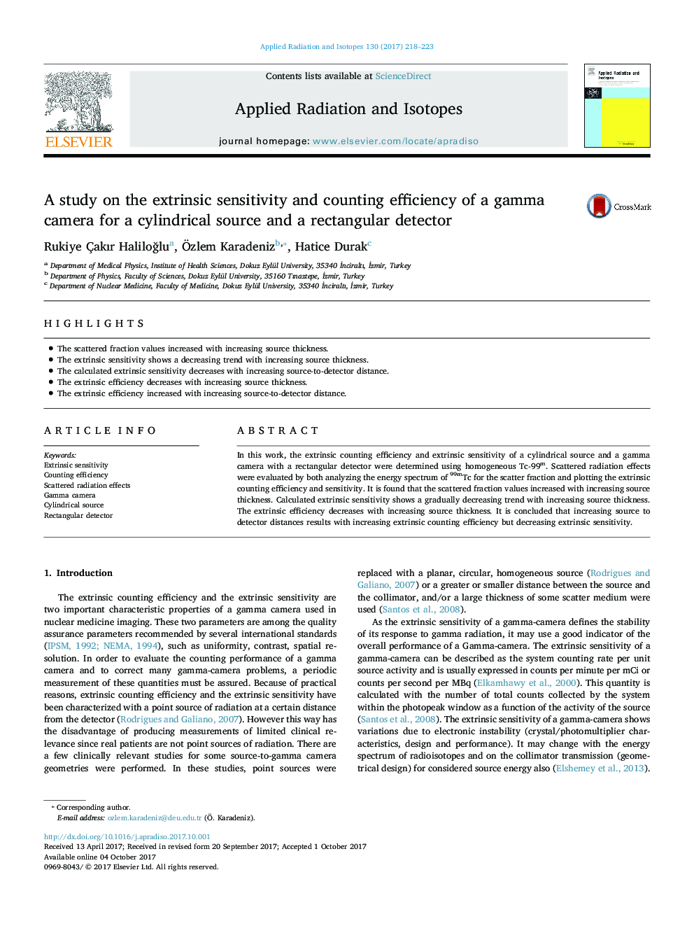 A study on the extrinsic sensitivity and counting efficiency of a gamma camera for a cylindrical source and a rectangular detector