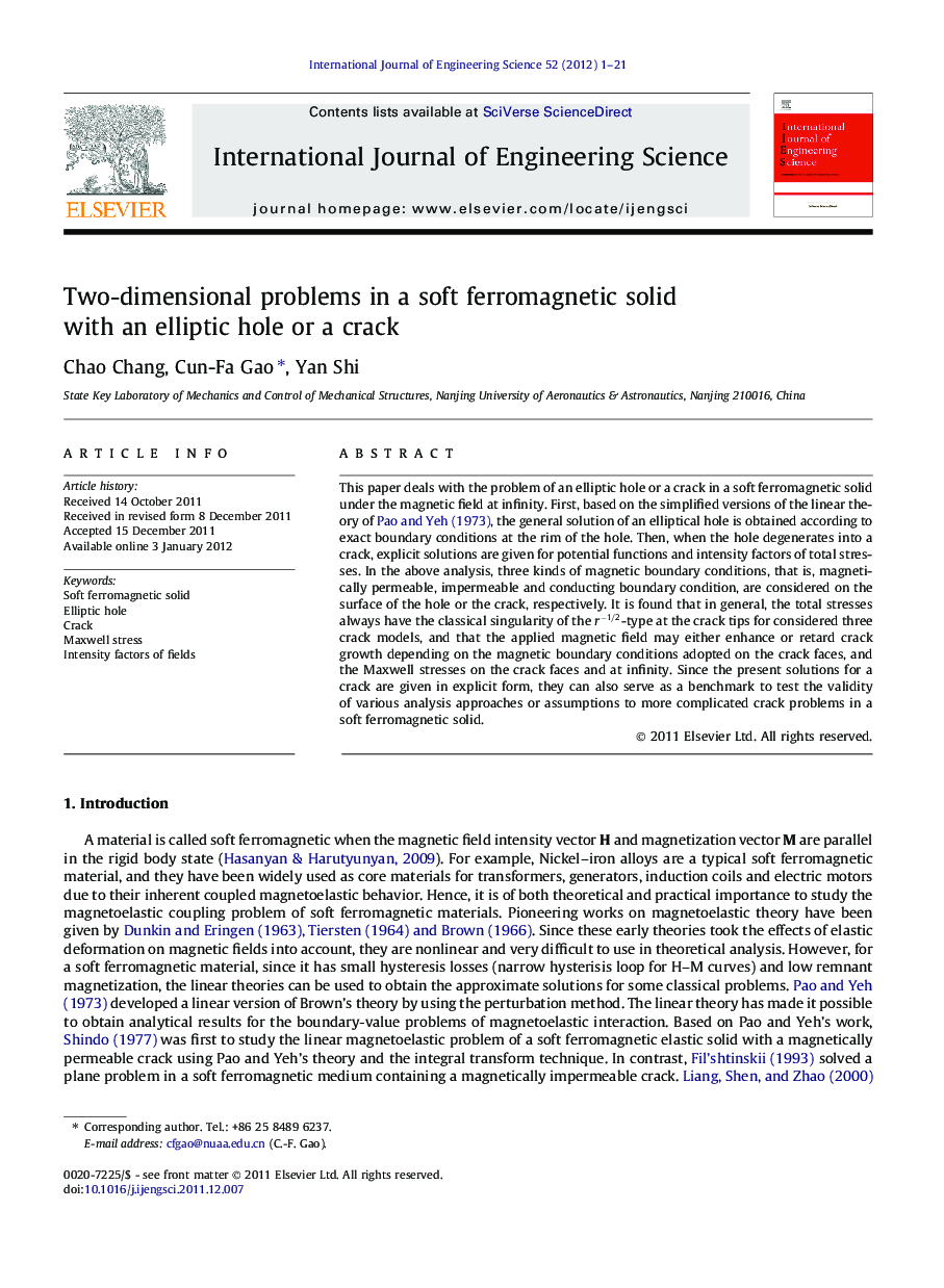 Two-dimensional problems in a soft ferromagnetic solid with an elliptic hole or a crack