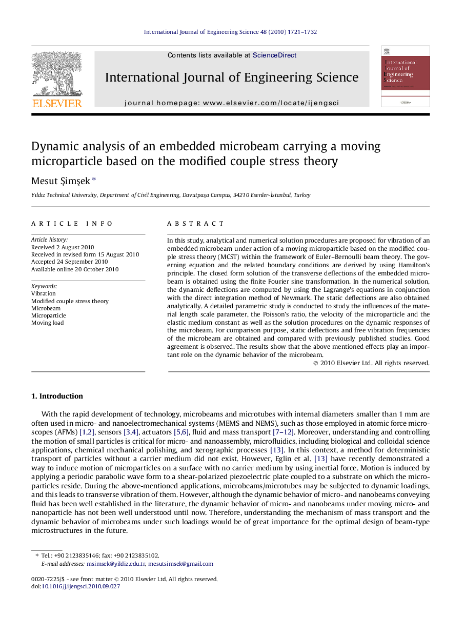 Dynamic analysis of an embedded microbeam carrying a moving microparticle based on the modified couple stress theory