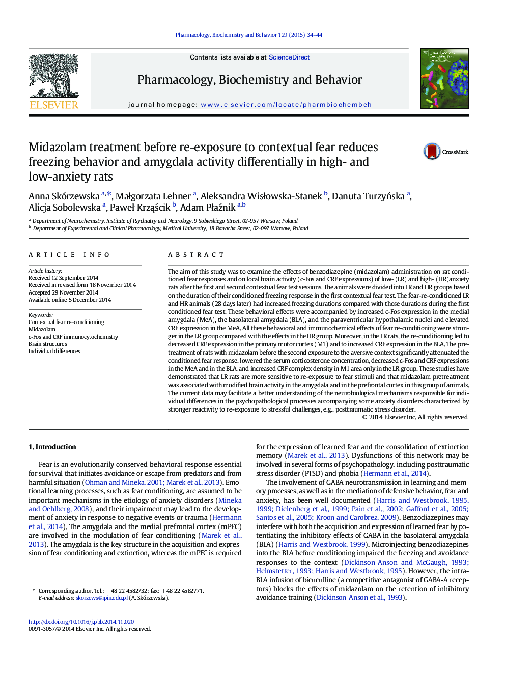 Midazolam treatment before re-exposure to contextual fear reduces freezing behavior and amygdala activity differentially in high- and low-anxiety rats