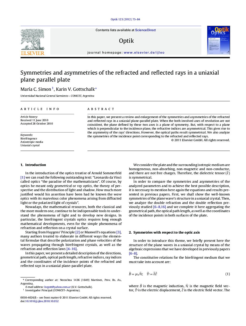 Symmetries and asymmetries of the refracted and reflected rays in a uniaxial plane parallel plate