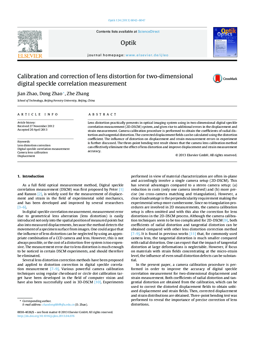 Calibration and correction of lens distortion for two-dimensional digital speckle correlation measurement