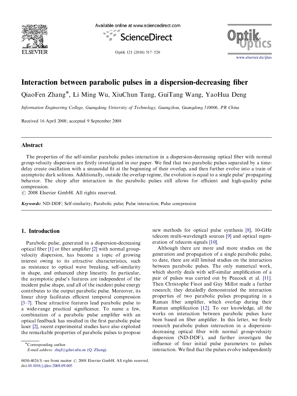 Interaction between parabolic pulses in a dispersion-decreasing fiber