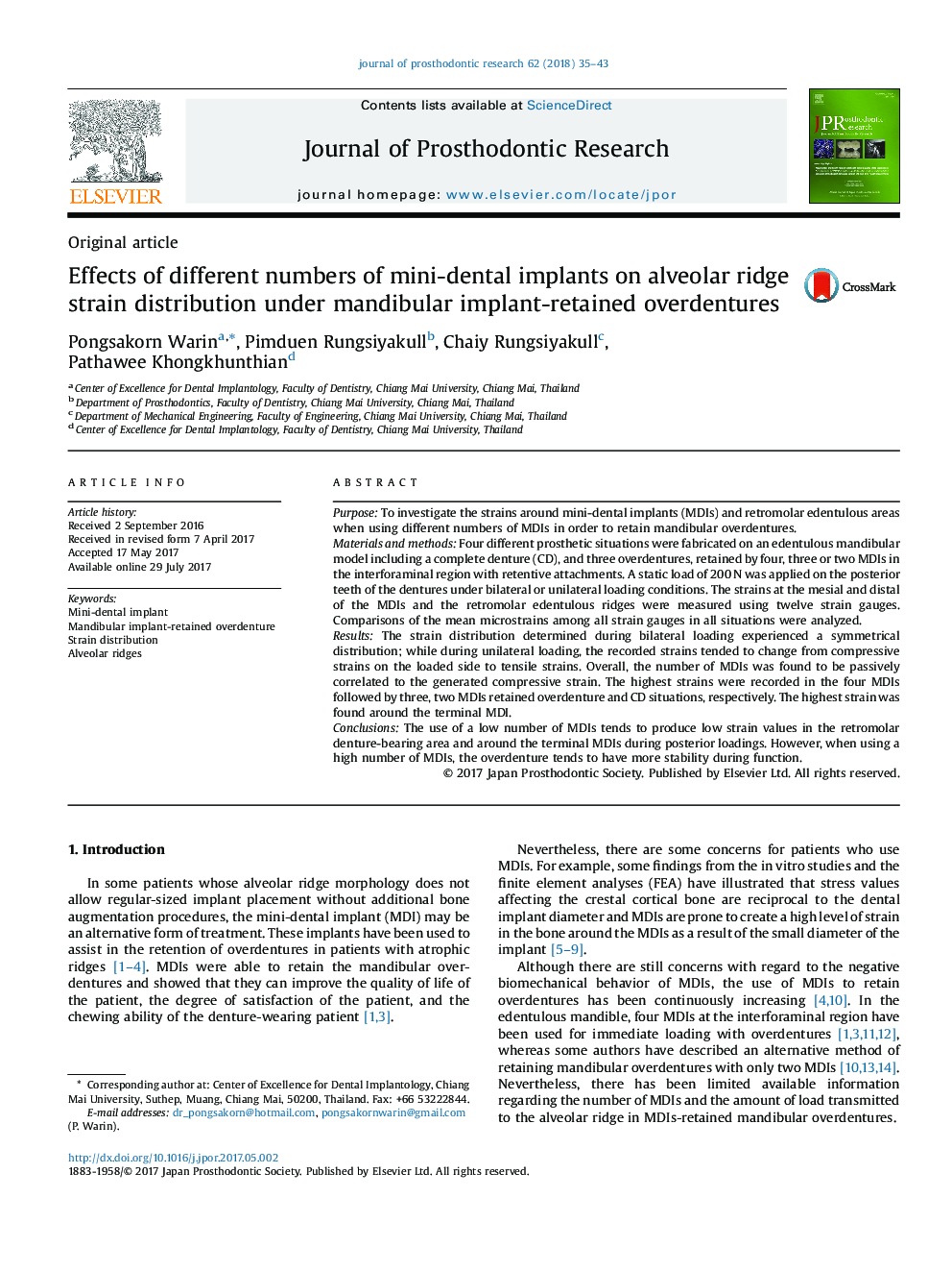Effects of different numbers of mini-dental implants on alveolar ridge strain distribution under mandibular implant-retained overdentures