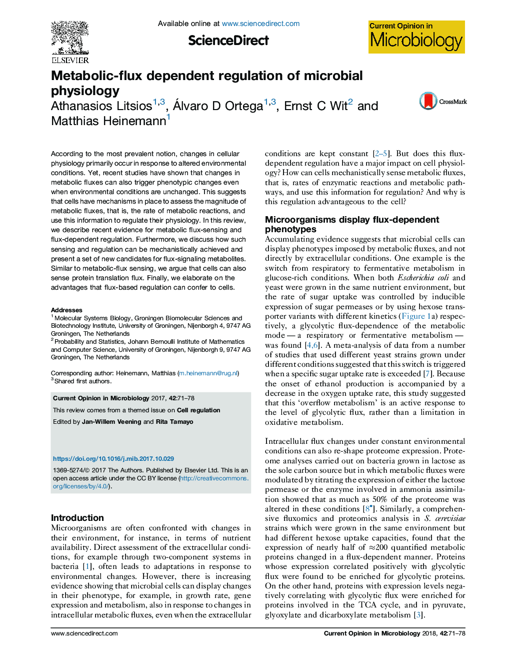 Metabolic-flux dependent regulation of microbial physiology