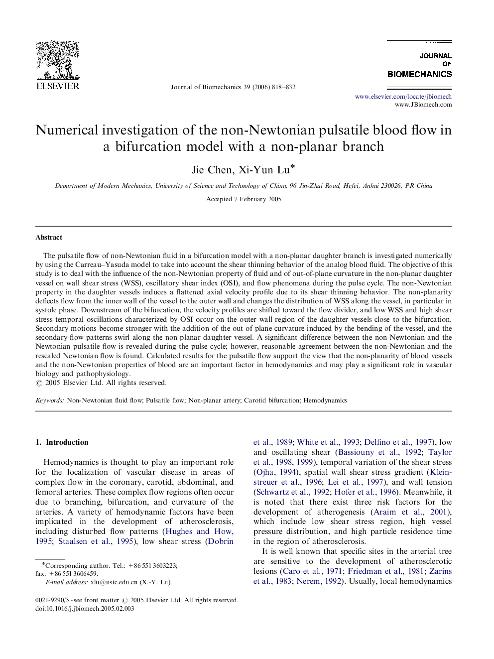 Numerical investigation of the non-Newtonian pulsatile blood flow in a bifurcation model with a non-planar branch