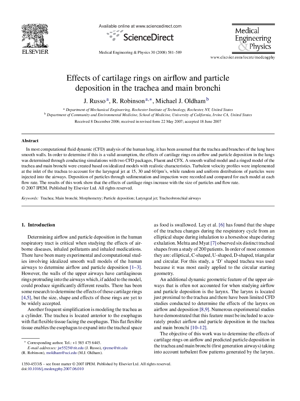 Effects of cartilage rings on airflow and particle deposition in the trachea and main bronchi