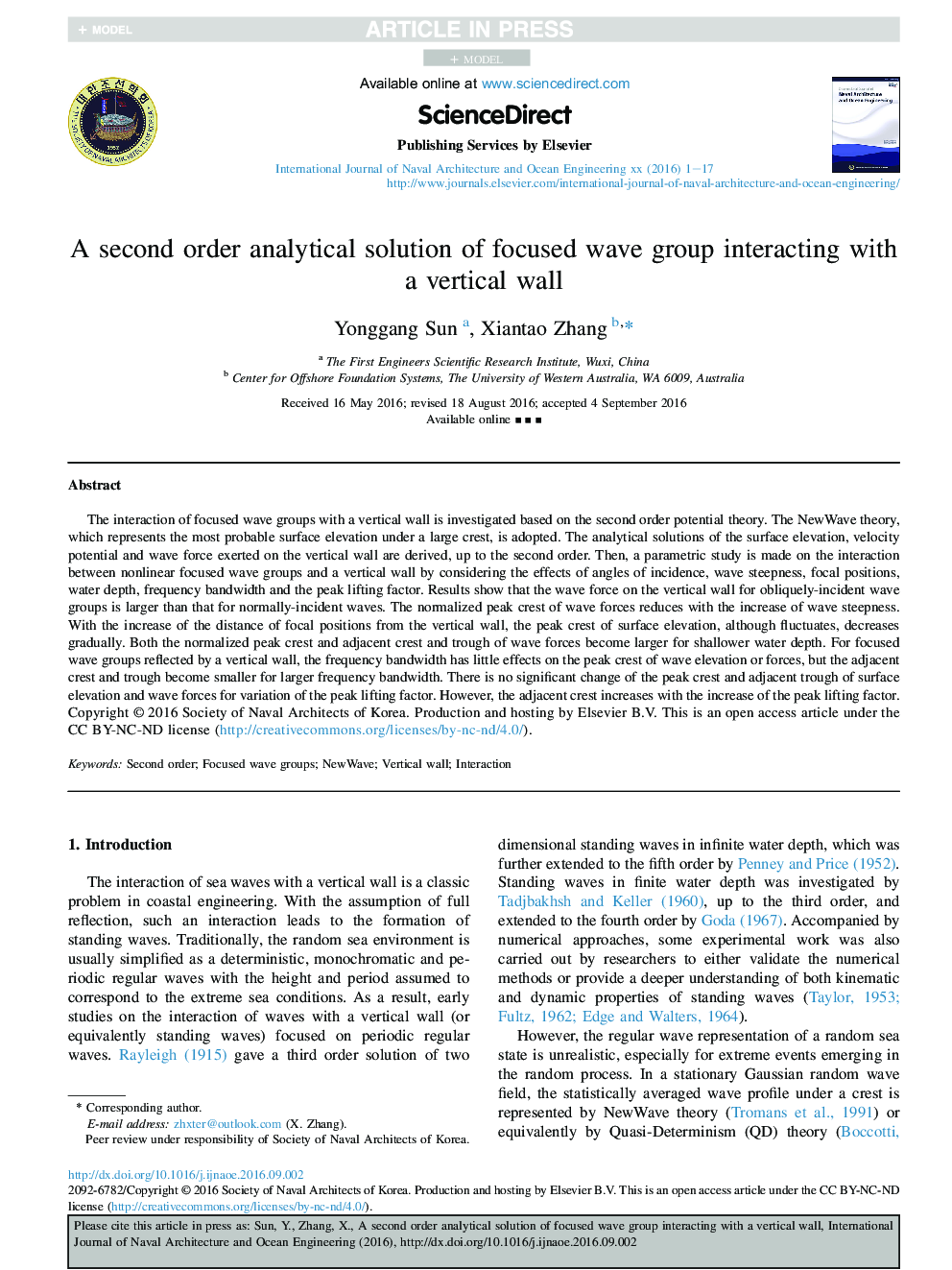 A second order analytical solution of focused wave group interacting with aÂ vertical wall