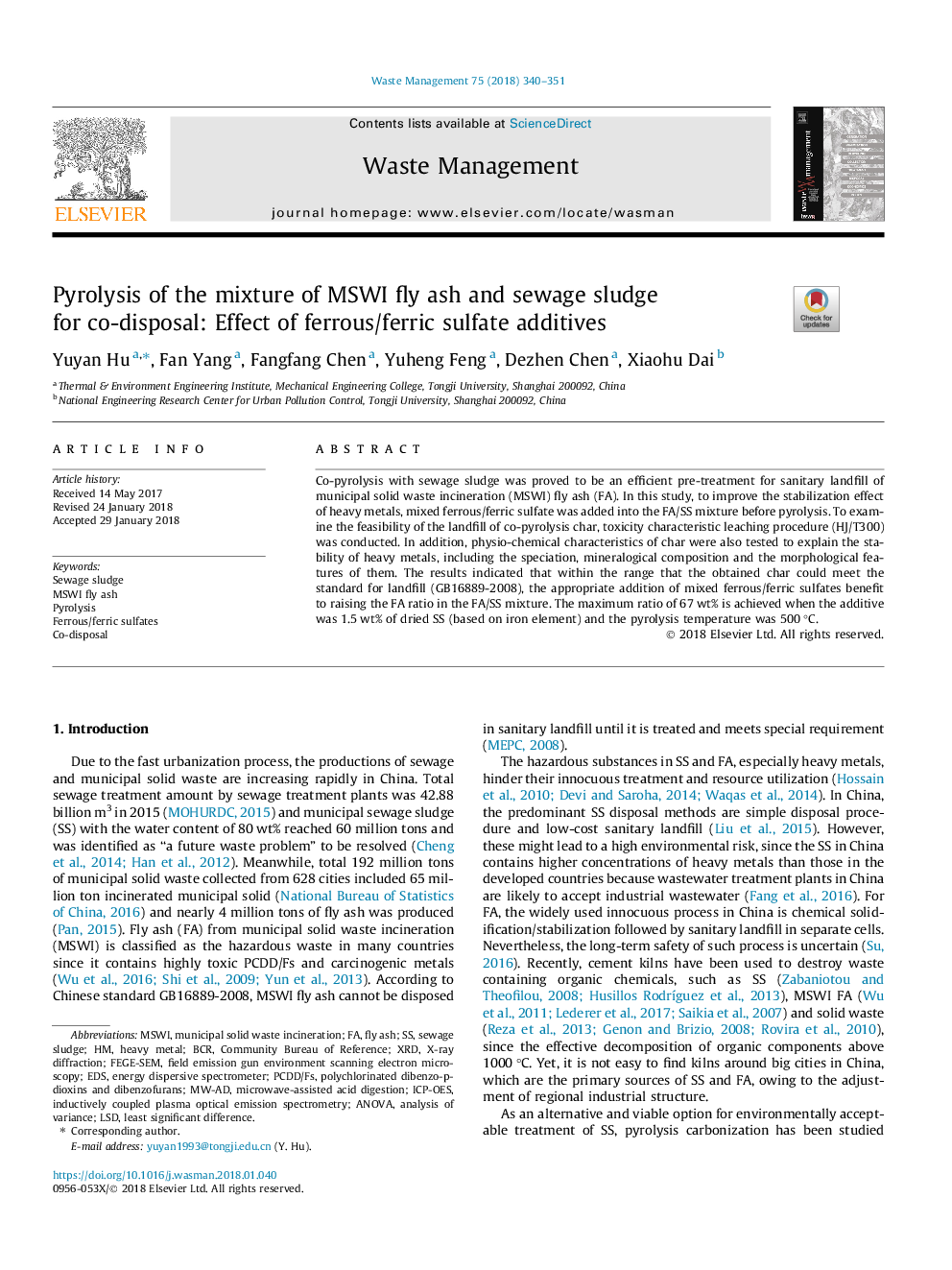 Pyrolysis of the mixture of MSWI fly ash and sewage sludge for co-disposal: Effect of ferrous/ferric sulfate additives