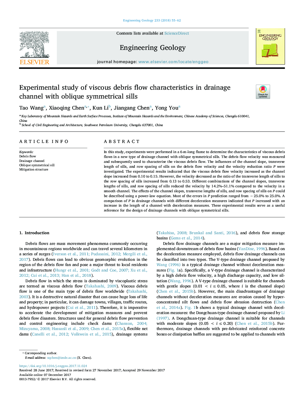 Experimental study of viscous debris flow characteristics in drainage channel with oblique symmetrical sills