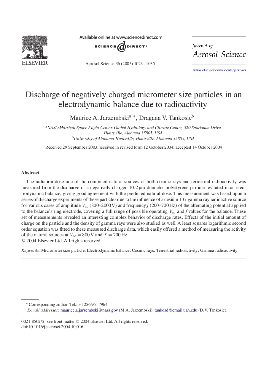 Discharge of negatively charged micrometer size particles in an electrodynamic balance due to radioactivity