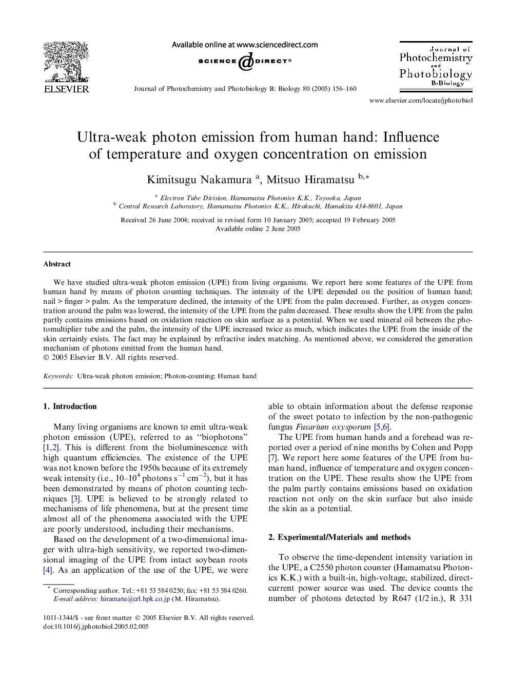 Ultra-weak photon emission from human hand: Influence of temperature and oxygen concentration on emission