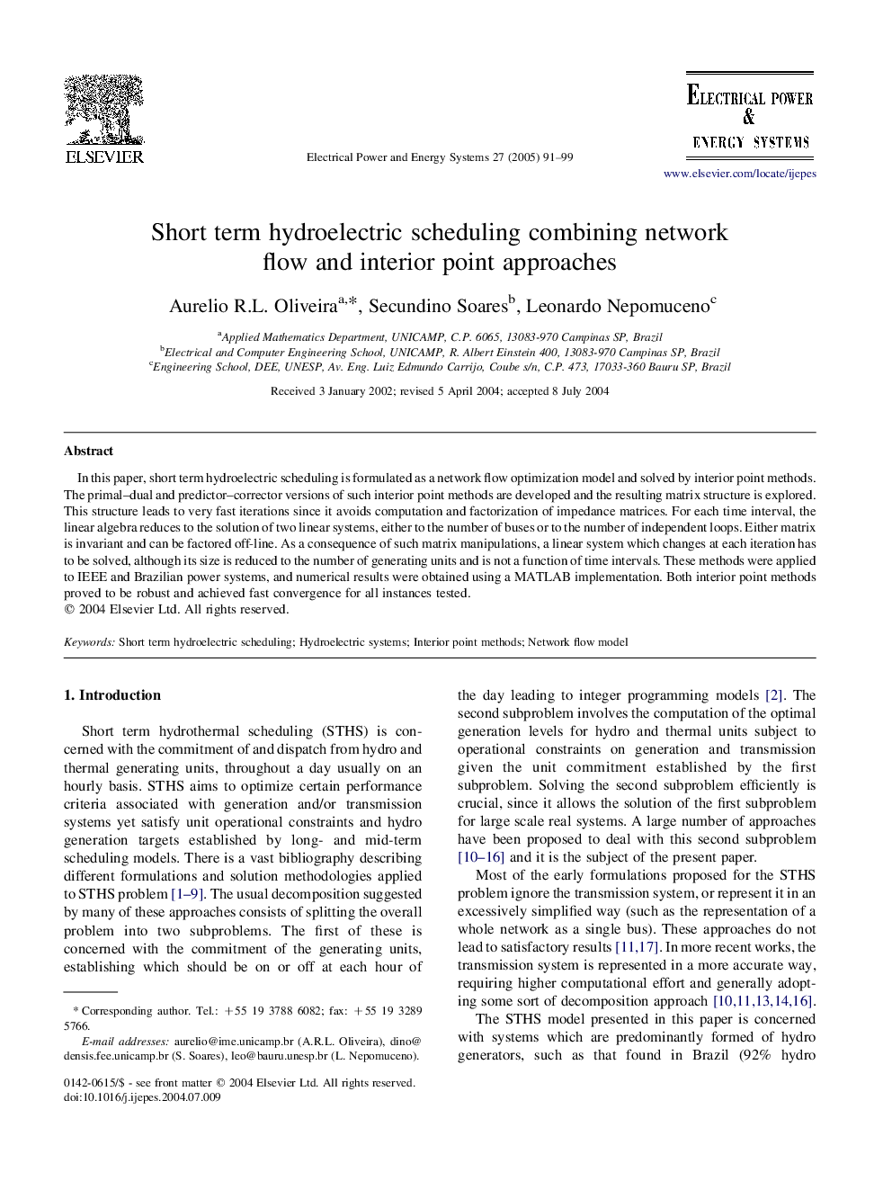 Short term hydroelectric scheduling combining network flow and interior point approaches