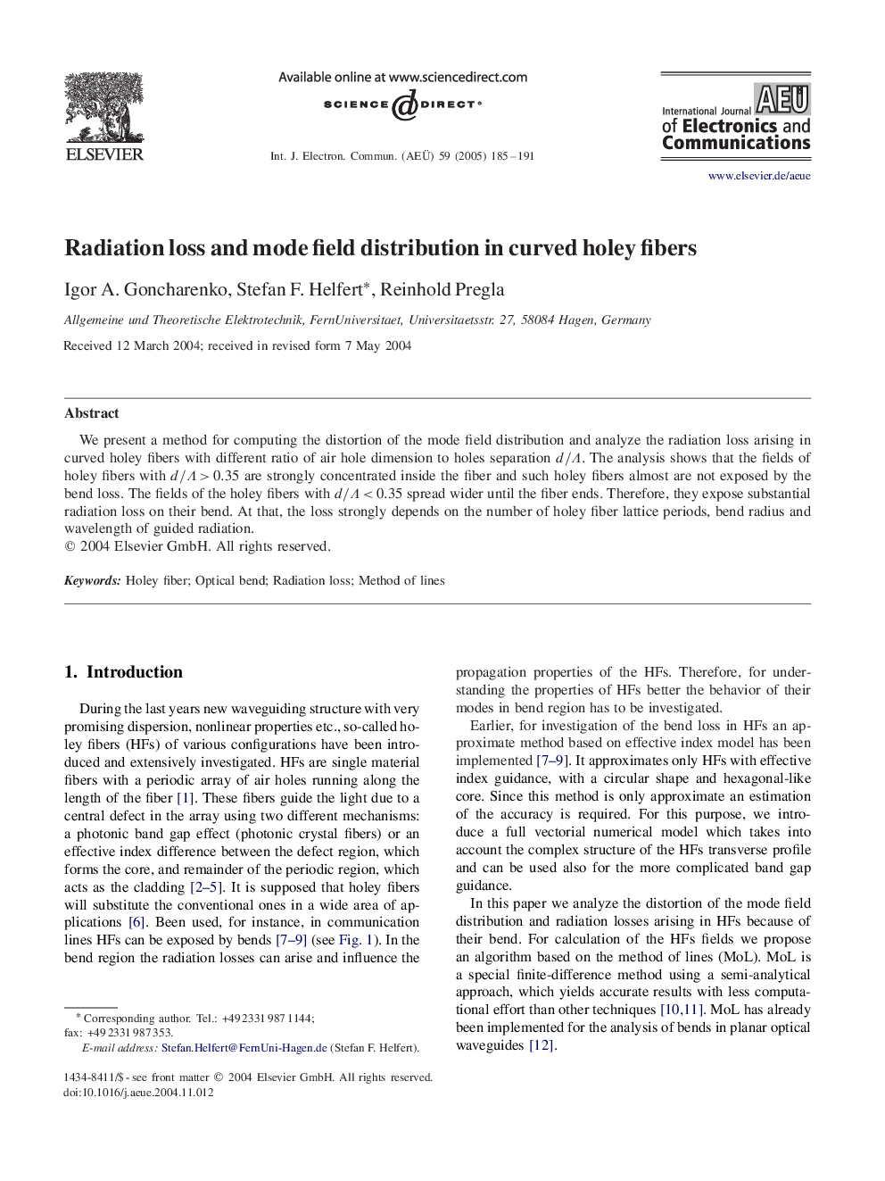 Radiation loss and mode field distribution in curved holey fibers