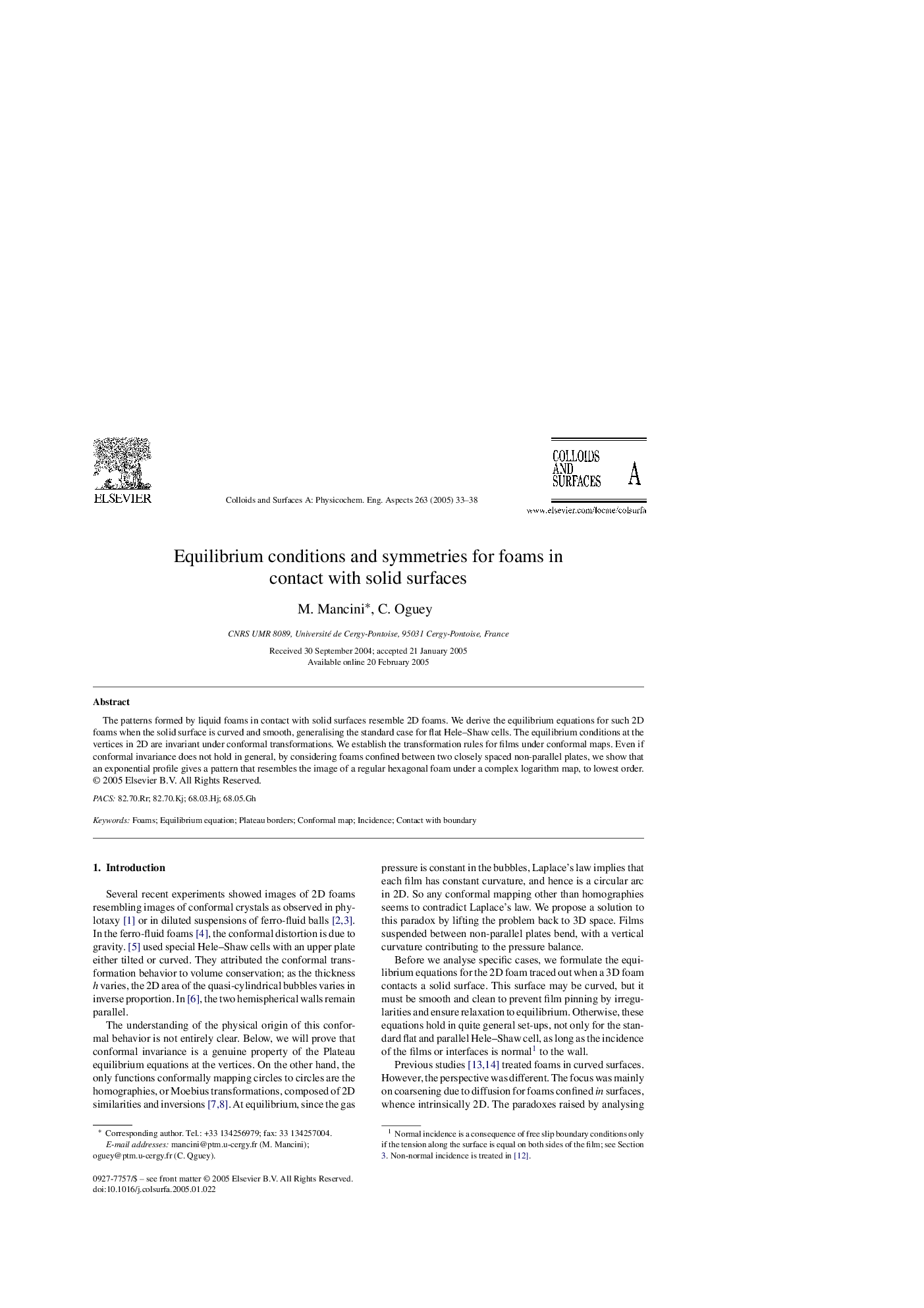 Equilibrium conditions and symmetries for foams in contact with solid surfaces