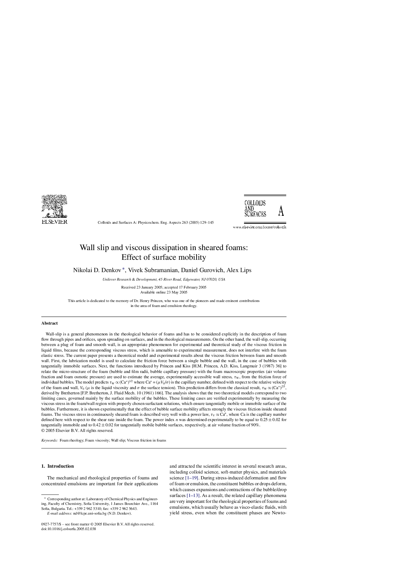 Wall slip and viscous dissipation in sheared foams: Effect of surface mobility