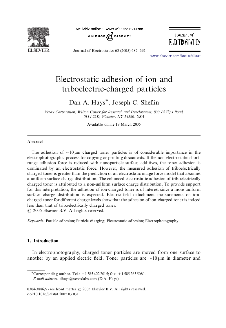 Electrostatic adhesion of ion and triboelectric-charged particles