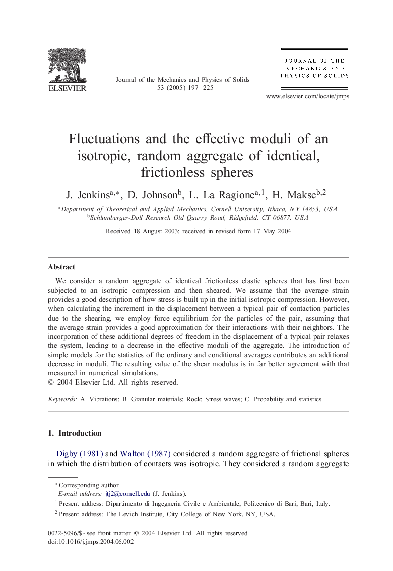 Fluctuations and the effective moduli of an isotropic, random aggregate of identical, frictionless spheres