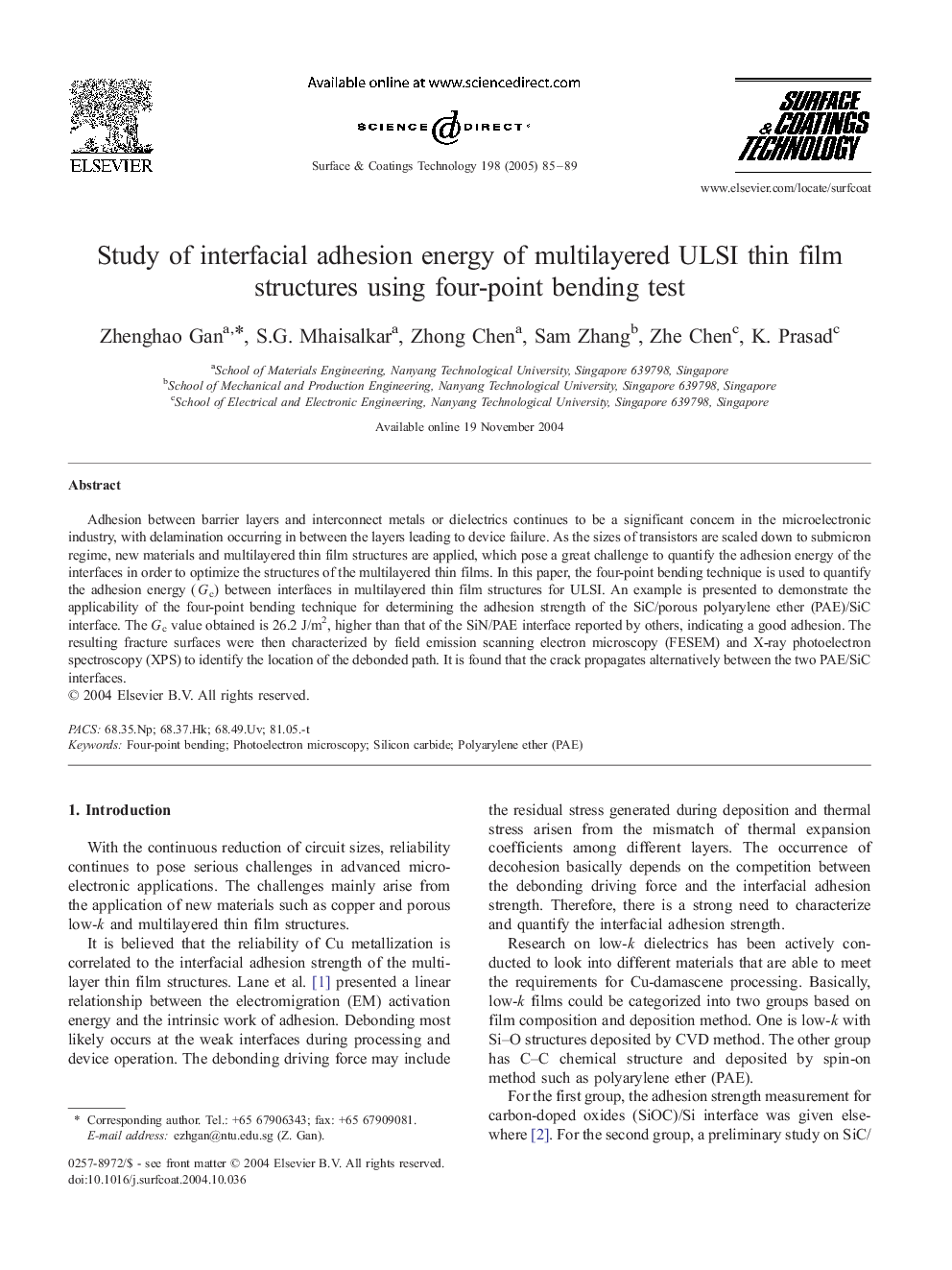 Study of interfacial adhesion energy of multilayered ULSI thin film structures using four-point bending test