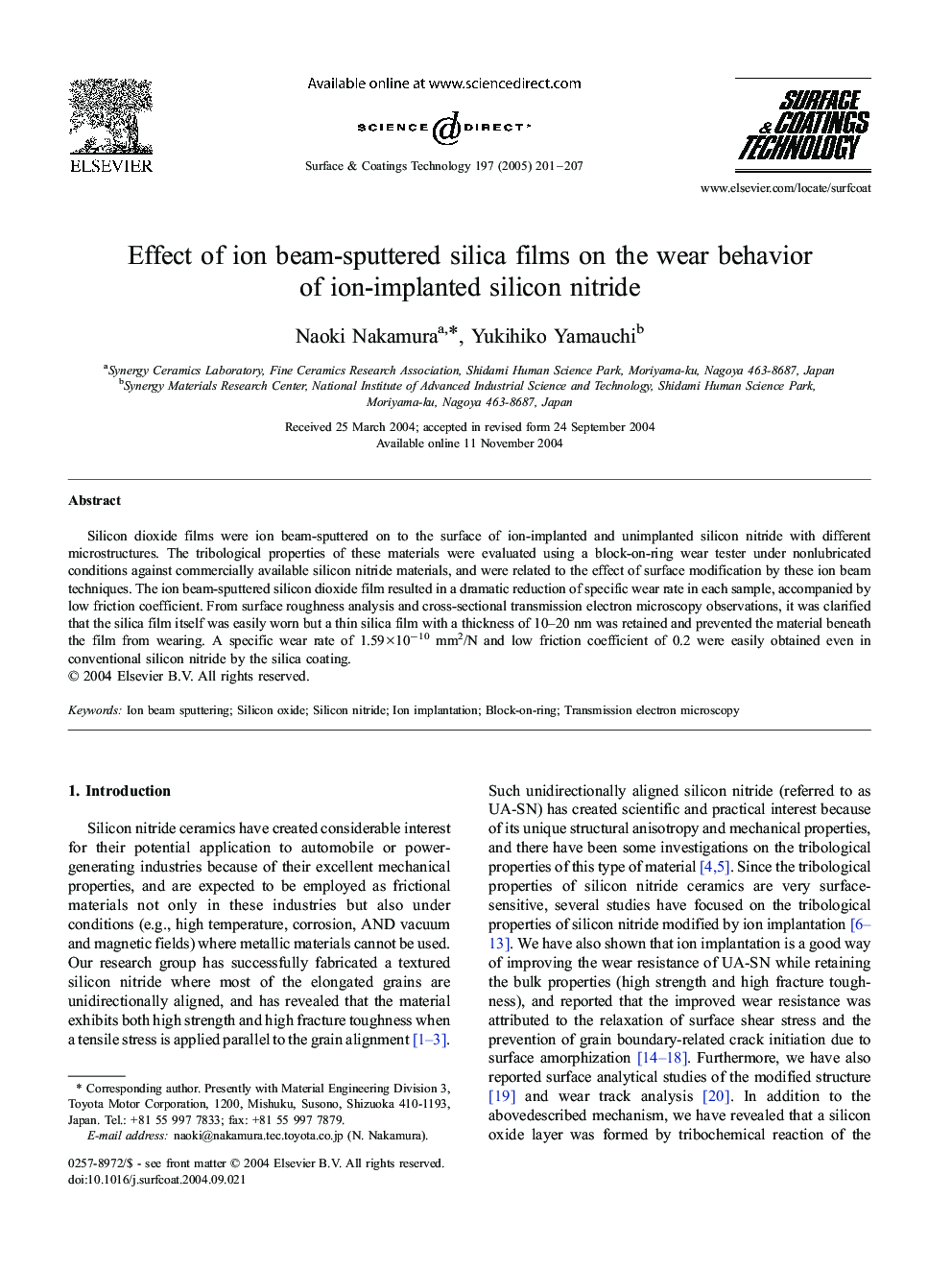 Effect of ion beam-sputtered silica films on the wear behavior of ion-implanted silicon nitride