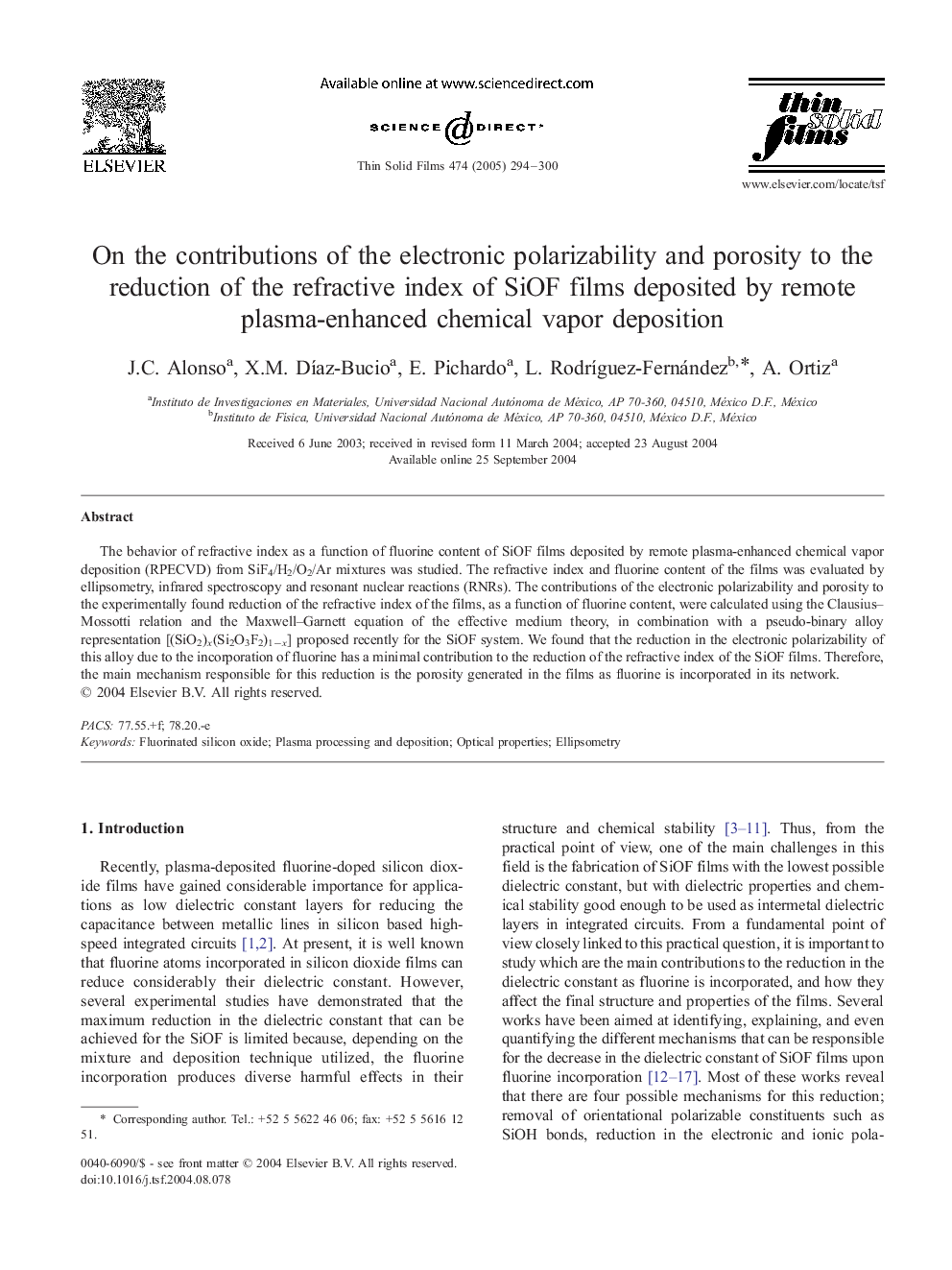 On the contributions of the electronic polarizability and porosity to the reduction of the refractive index of SiOF films deposited by remote plasma-enhanced chemical vapor deposition