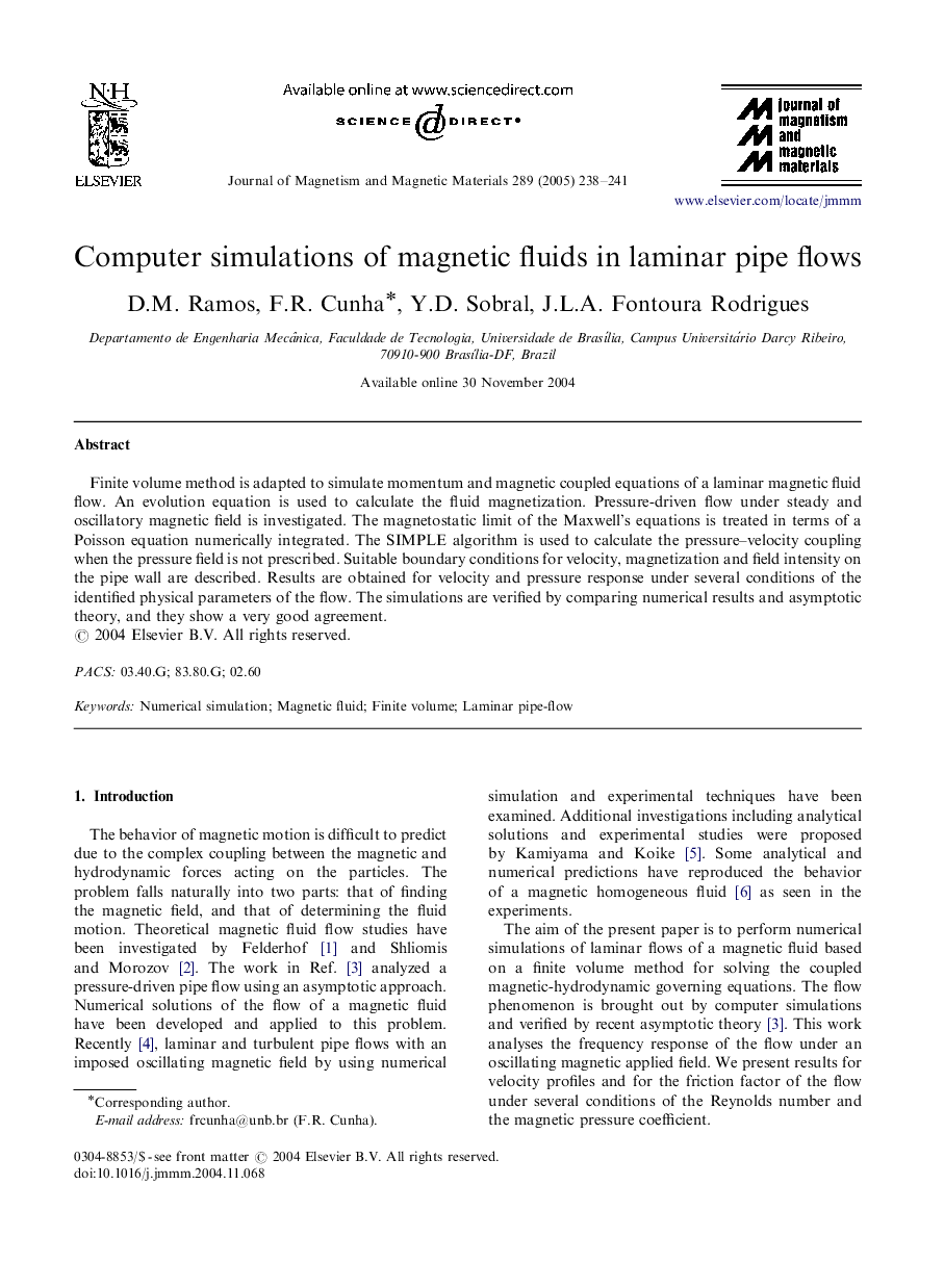 Computer simulations of magnetic fluids in laminar pipe flows