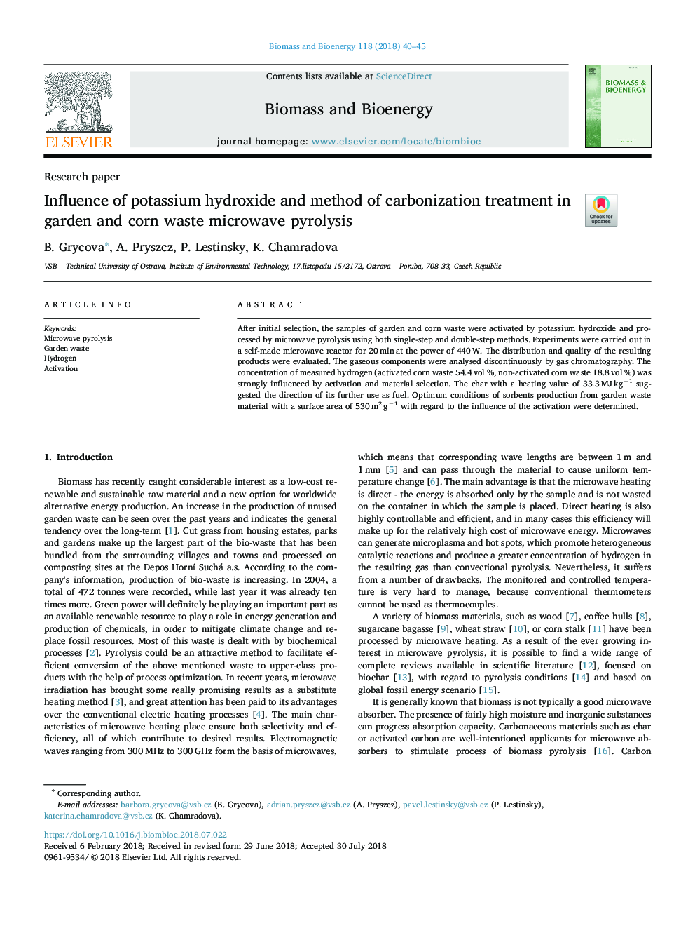 Influence of potassium hydroxide and method of carbonization treatment in garden and corn waste microwave pyrolysis